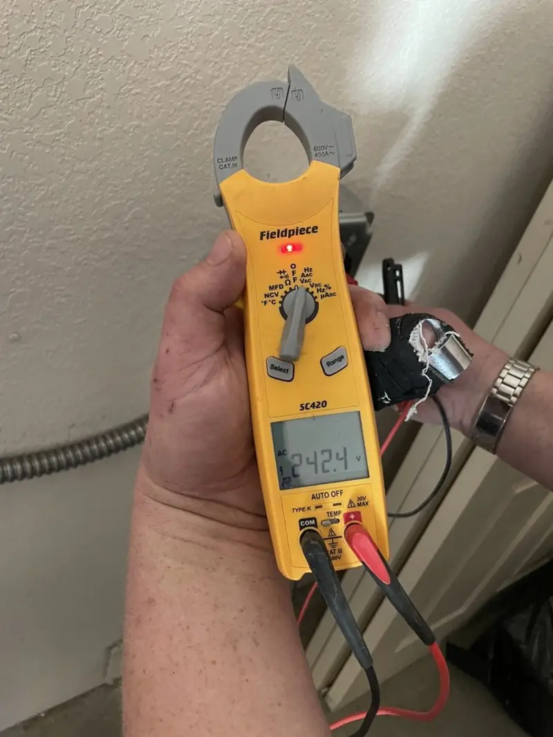 Voltage testing with clamp meter during Electrical Installation Services in Guadalupe